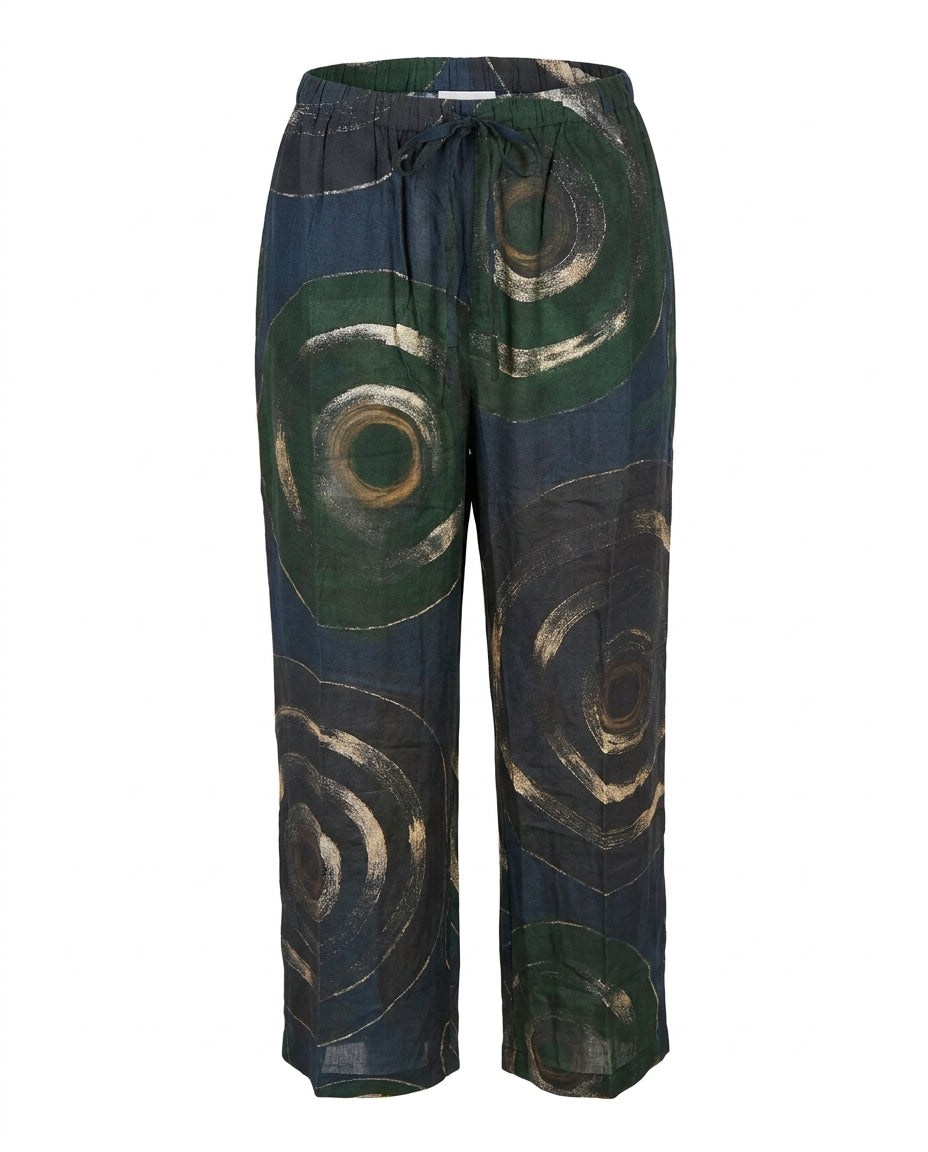 Pantalon fluide Cofur en soie de sari upcyclée, grands cercles peints main beige et or sur fond noir et vert sapin, taille à cordon