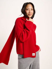Écharpe côtelée laine et coton bio LANIUS Rouge portée en ton sur ton avec un pull rouge